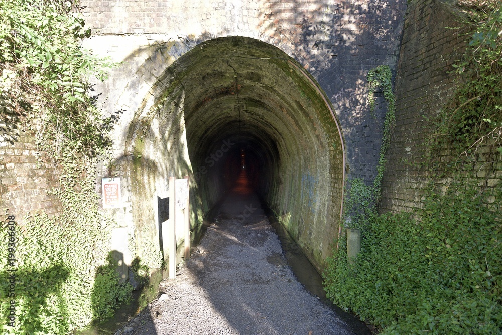 Entrance of a long brick lined tunnel