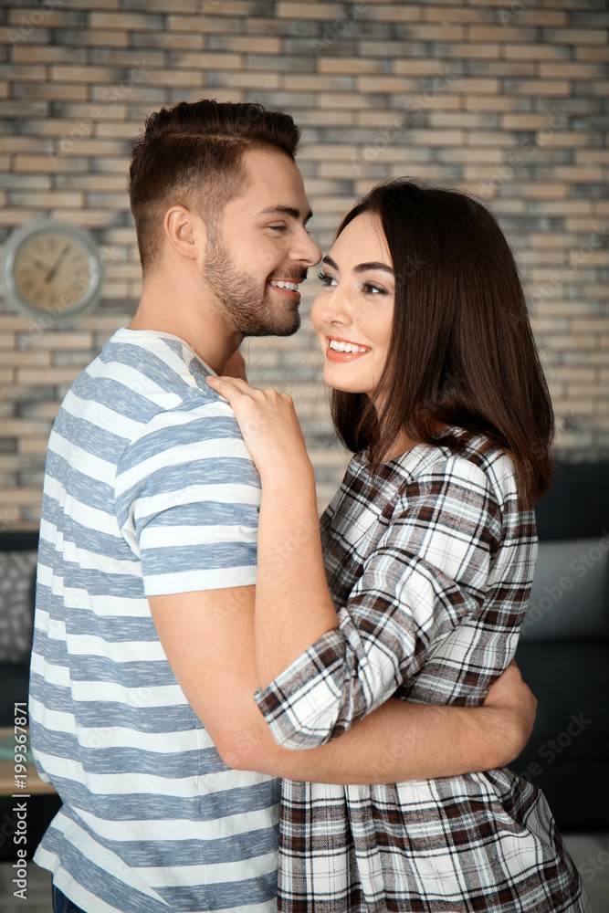 Beautiful young couple dancing indoors Beautiful young couple dancing indoors