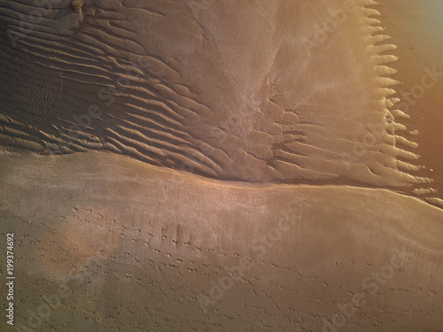 Patterns on wet beach sand