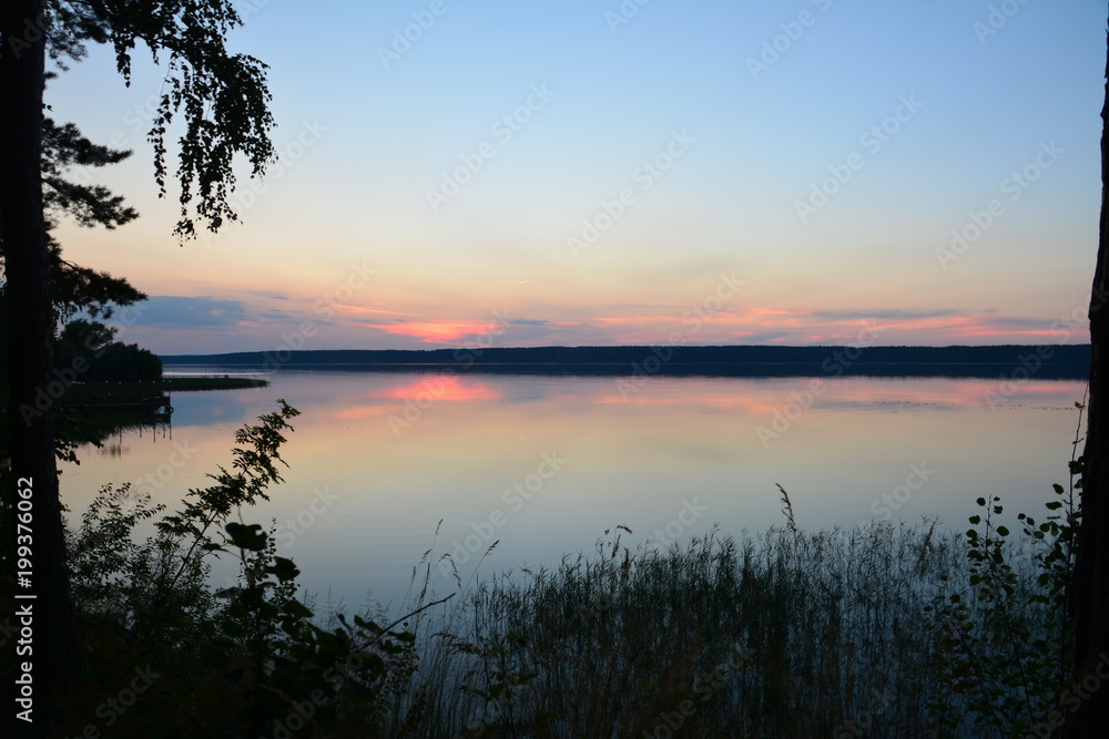 Sunset on the clam. Calm near Volga