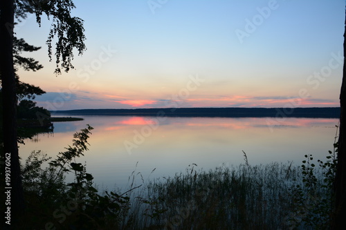 Sunset on the clam. Calm near Volga