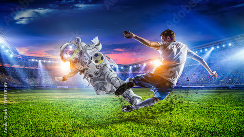 Fototapeta Naklejka Na Ścianę i Meble -  Astronaut play soccer game