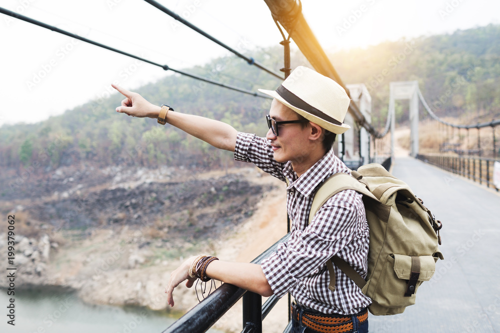 Man traveller on Mae Kuang Suspension bridge. Man traveller on Mae Kuang Suspension bridge.