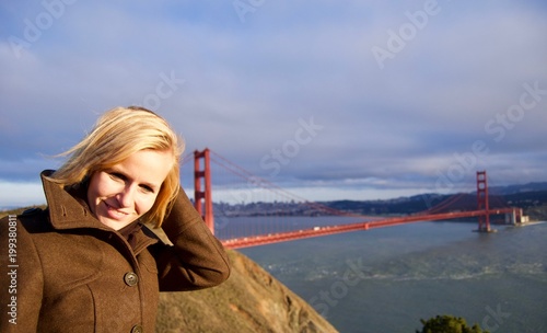 Blonde Woman in front of Golden Gate Bridge, San Francisco - California, USA © ICW