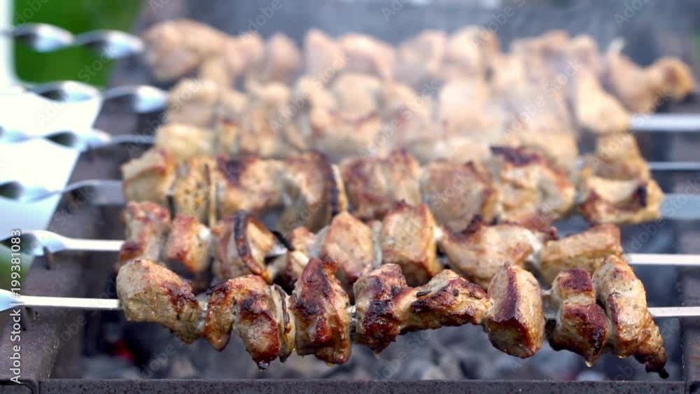 Grilling pork kebab on skewers at bbq Grilling pork kebab on skewers at bbq