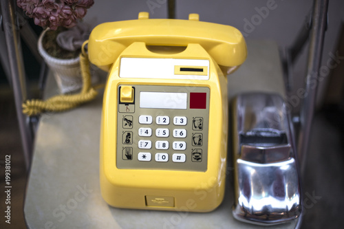 vintage yellow telephone isolated