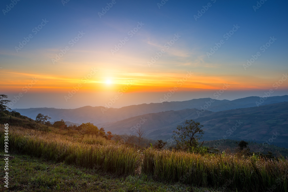 Sunrise Morning at mountain range view on nature trail in Pho lom lo National Park Loei province, Thailand.