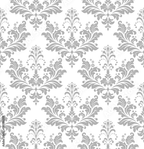 Wallpaper in the style of Baroque. A seamless vector background. White and grey floral ornament. Graphic vector pattern.