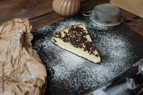 Fancy cheesecake in cafe with chocolate drops and spoon