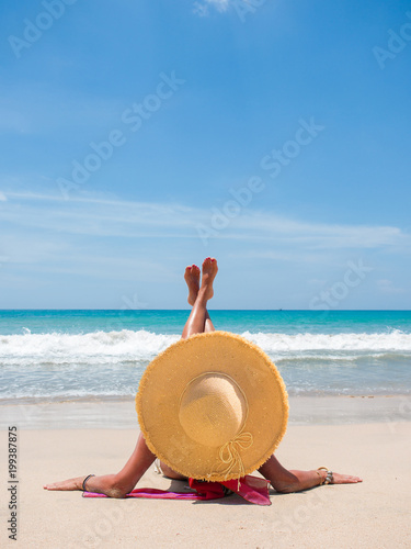 girl sitting on a tropical beach