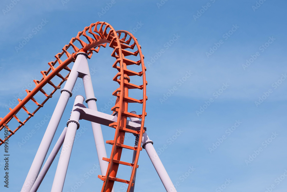 Roller coaster on blue sky background. Stock Photo | Adobe Stock