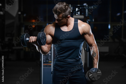 Handsome model young man workout in gym