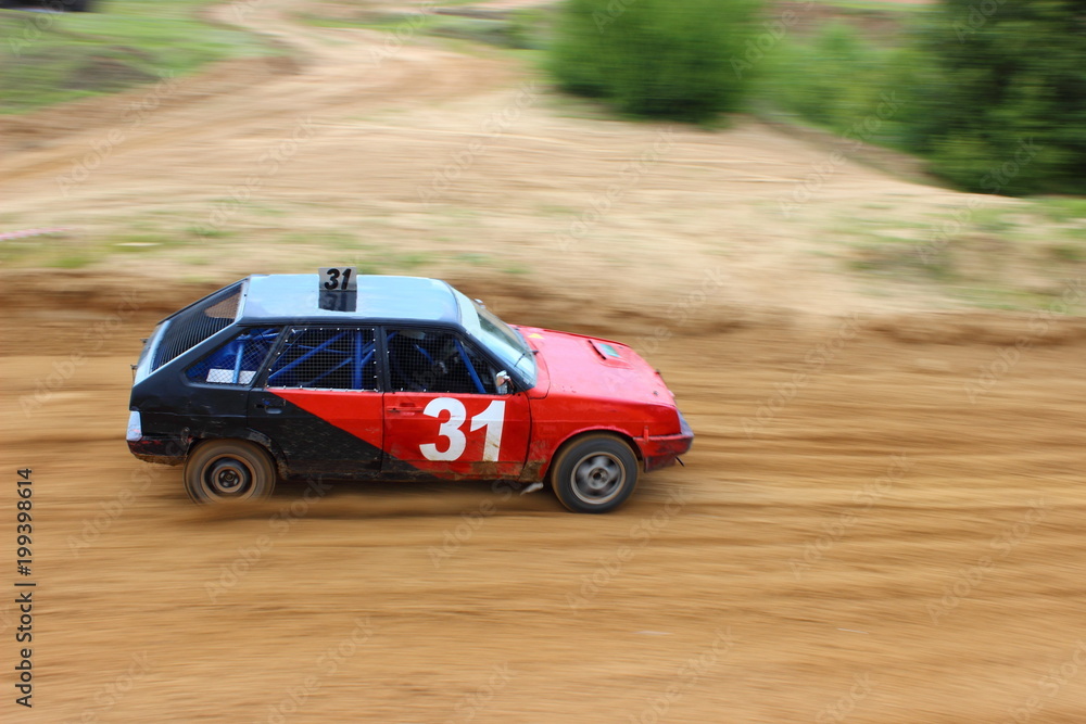 Autocross in Russia, red-black sports car VAZ 2108 on a dirt track