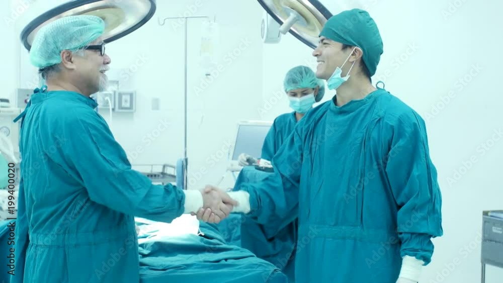 Male doctor shake hand together when finish work. Healthcare and Medical concept. Male doctor shake hand together when finish work. Healthcare and Medical concept.