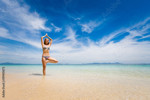 Yoga on tropical thai beach photo