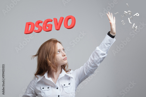 DSGVO, german version of GDPR, concept image. General Data Protection Regulation, protection of personal data. Young woman working with information. Datenschutz-Grundverordnung. photo