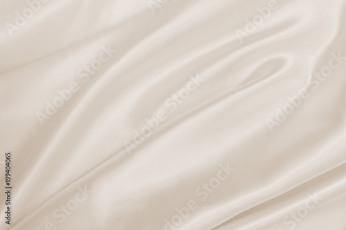 Smooth elegant golden silk or satin luxury cloth texture as wedding background