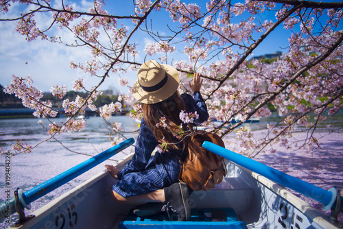 Photography Woman is enjoy travel during spring in Japan.