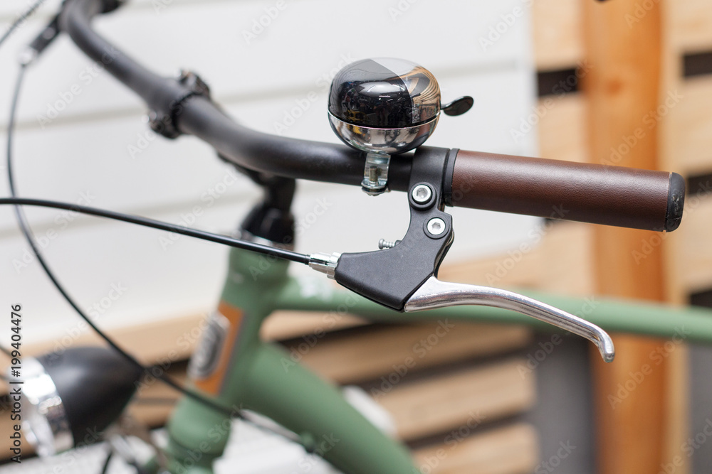 Bicycle steering wheel with bell and leather handles. Vintage bicycle rudder. Bicycle steering wheel with bell and leather handles. Vintage bicycle rudder.