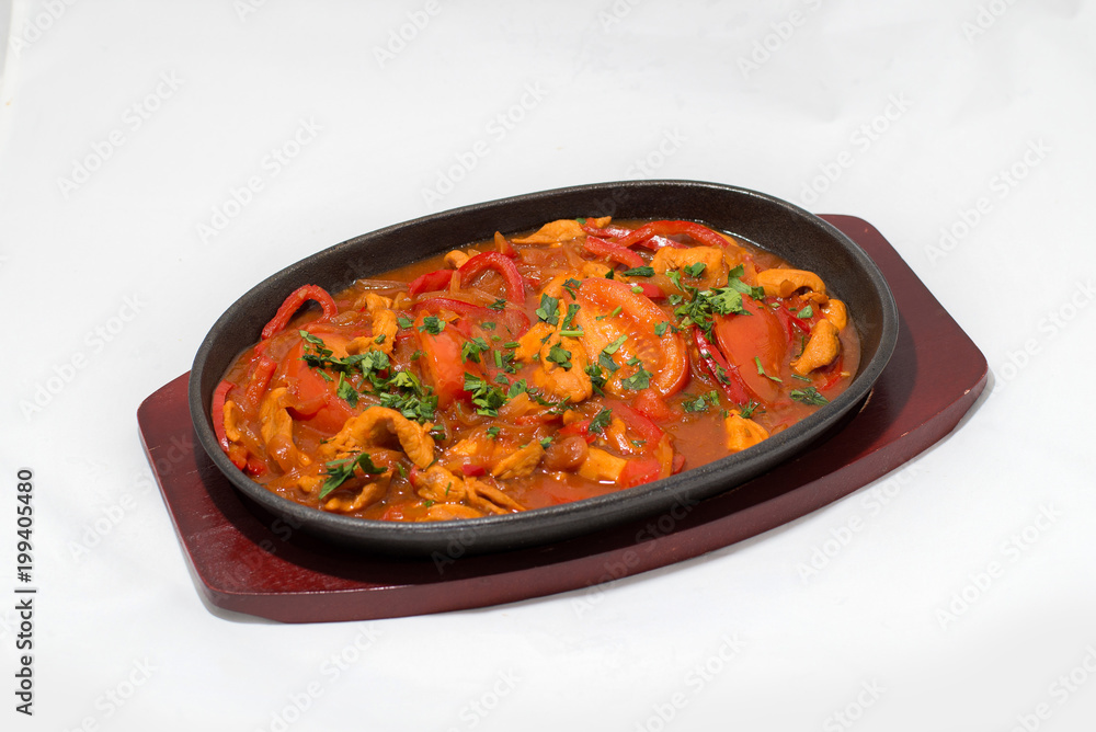 Snack vegetables meat on a frying pan on a tree white background Snack vegetables meat on a frying pan on a tree white background