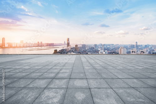 empty marble floor with cityscape and skyline in cloud sky