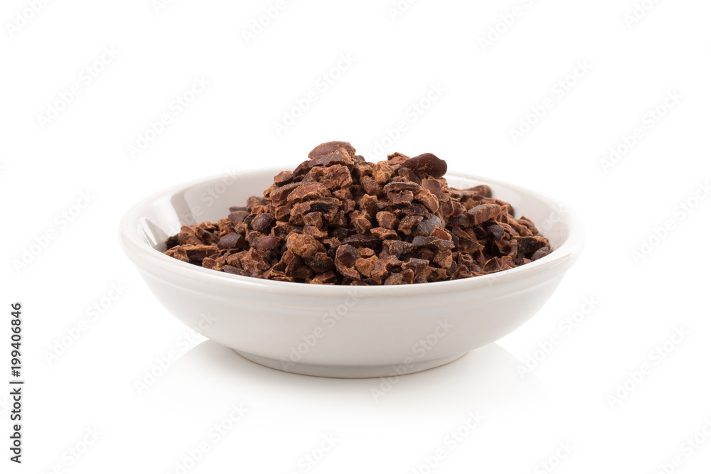 Bowl of cacao nibs isolated on a white background Bowl of cacao nibs isolated on a white background