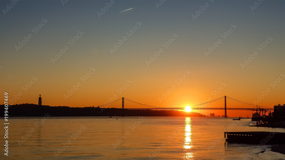 Sunset in Portugal against the backdrop of the bridge
