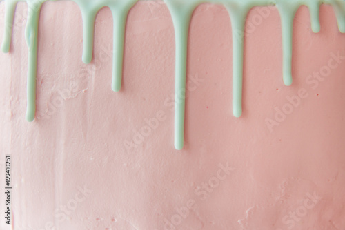 Photography The front side of the pink cake with cream drips. Copy space