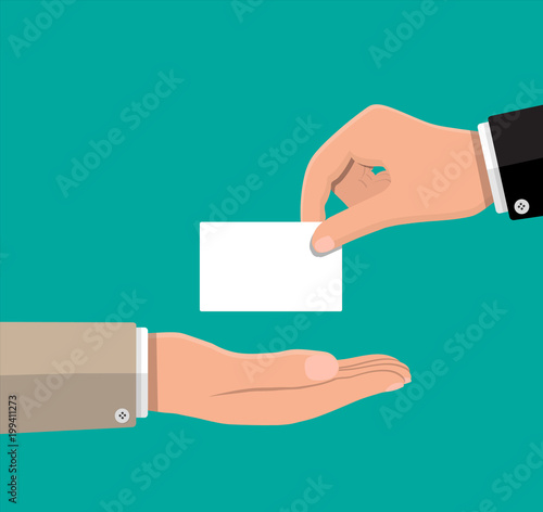 Businessman hand gives business card.