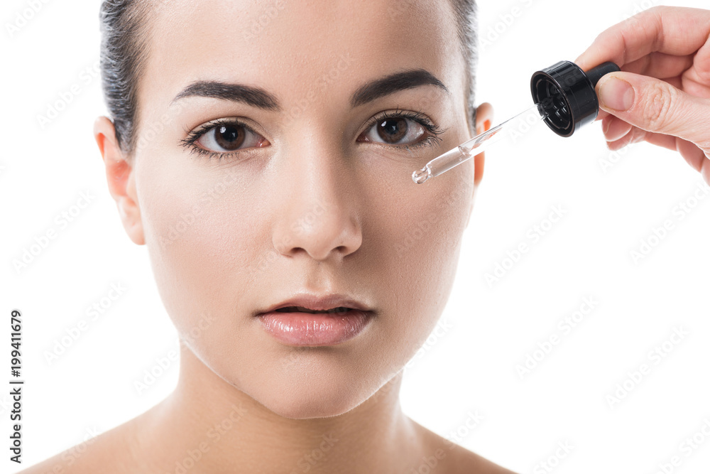 cropped image of visagiste doing makeup for girl isolated on white