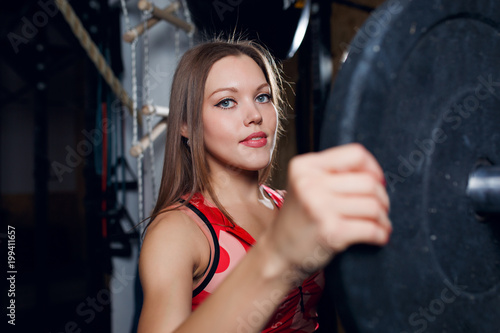 Photo of athlete with barbell