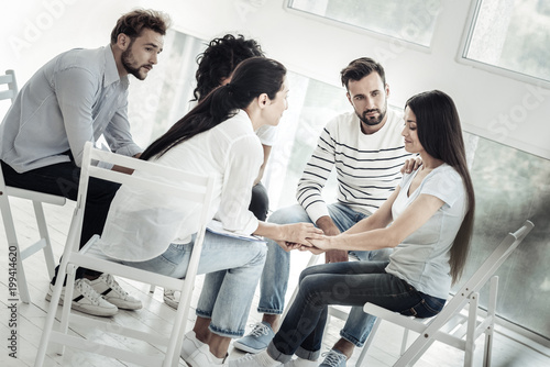 Be optimistic. Nice joyful friendly people sitting together and supporting their fried while feeling sympathetic towards her