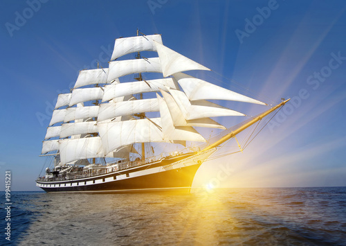 Sailing ship and sun rays. Sailing. Yachting