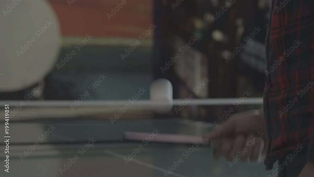 Playing with a ping pong paddle and ball Playing with a ping pong paddle and ball