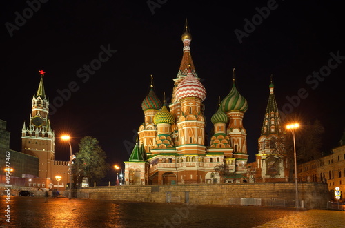 Cathedral of the Intercession of the virgin on the Moat (St. Basil's Cathedral) and the Spasskaya tower of the Moscow Kremlin in the winter evening, Russia