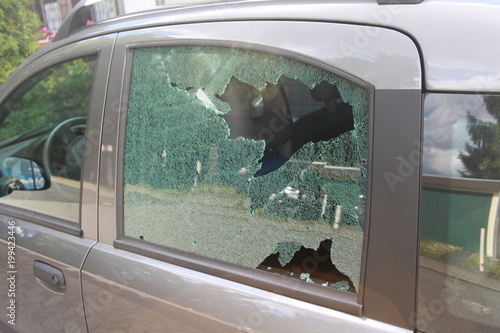 Close Up of a broken car window of a burgular photo