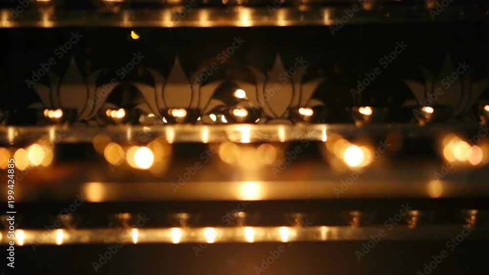 Candle flame close-up. Many Candles in a Buddhist temple. Religious Festival. Oil Lamp Candle flame close-up. Many Candles in a Buddhist temple. Religious Festival. Oil Lamp