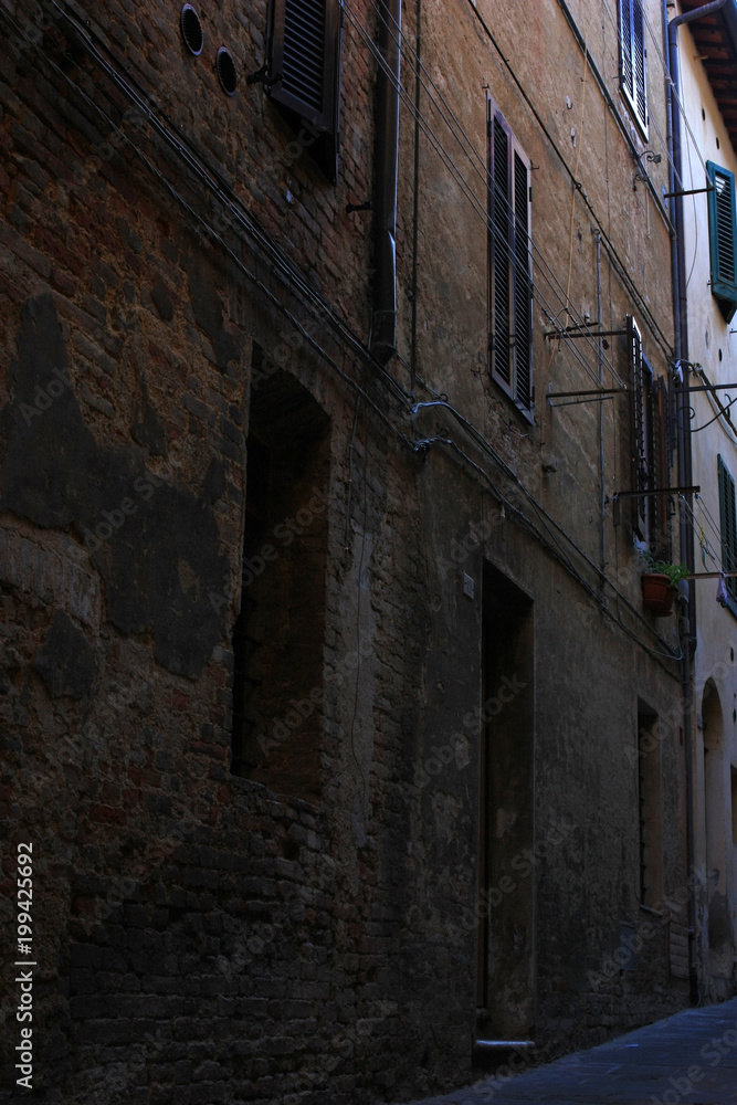 Narrow ancient street of the Italian city