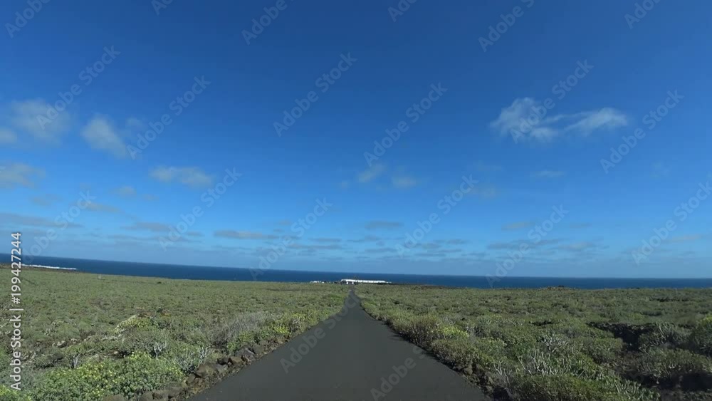 Car driving towards Jameos del Aguas in Cueva de los Verdes Lanzarote Spain