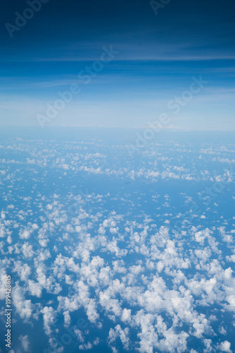 Sky background over spread cloud scatter, skyline separate zone between cloud and above blue