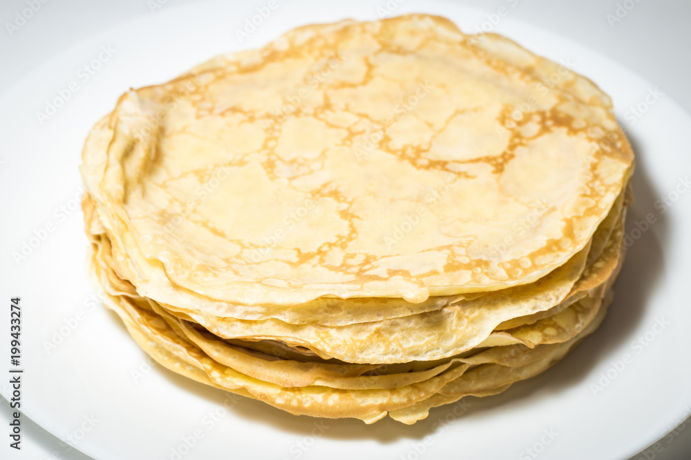Isolated pancakes on white backgdound, pancakes on white plate Isolated pancakes on white backgdound, pancakes on white plate