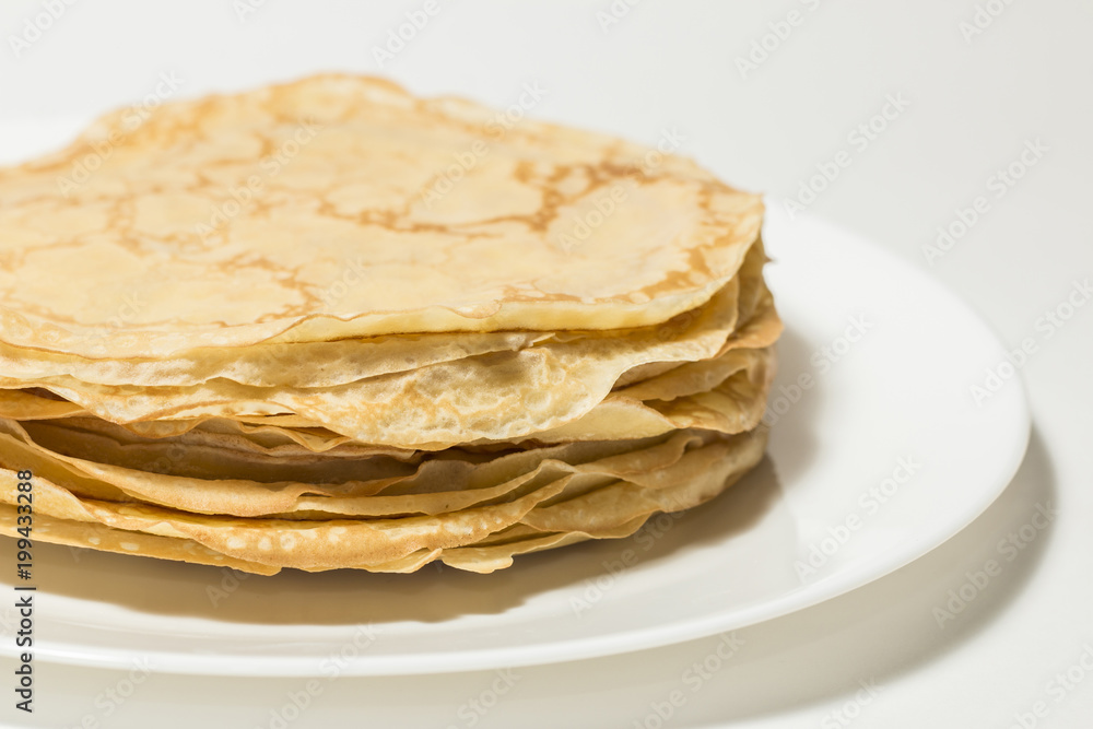 Isolated pancakes on white backgdound, pancakes on white plate Isolated pancakes on white backgdound, pancakes on white plate