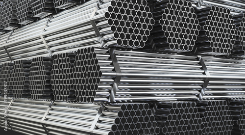 Stack of steel pipes in warehouse. Rolled metal products. 3d illustration.