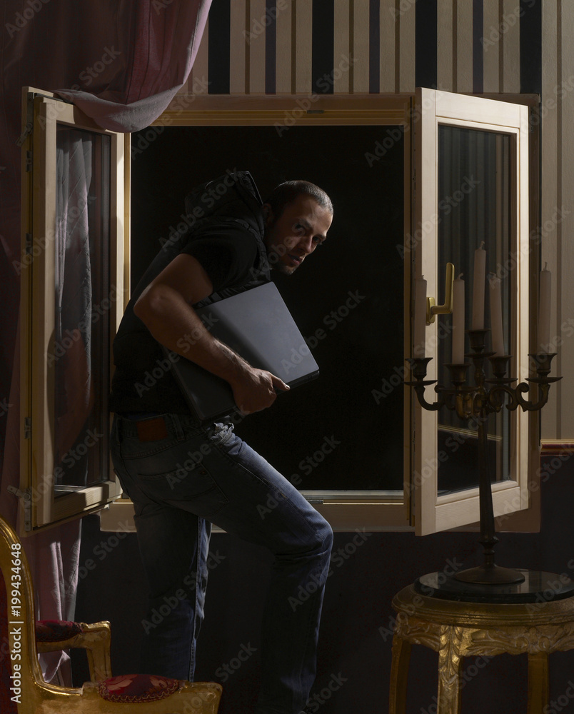 Man stealing from the house Man stealing from the house