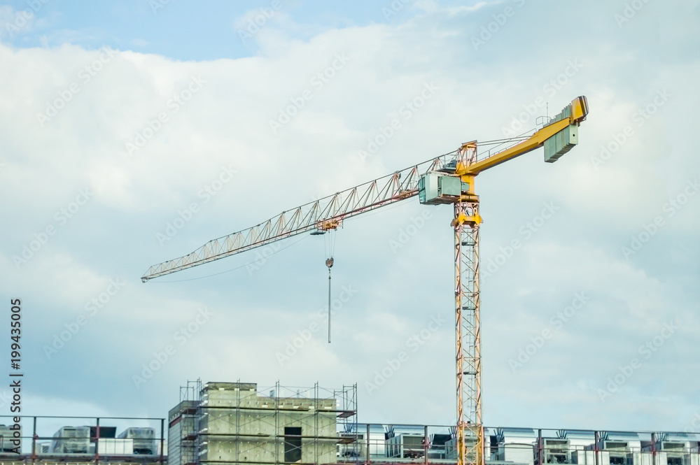 lift crane load stuff to the trucks on the roof of warehouse