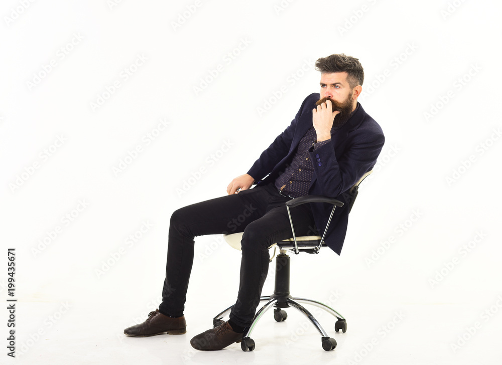 business man sitting on office chair with serious face business man sitting on office chair with serious face