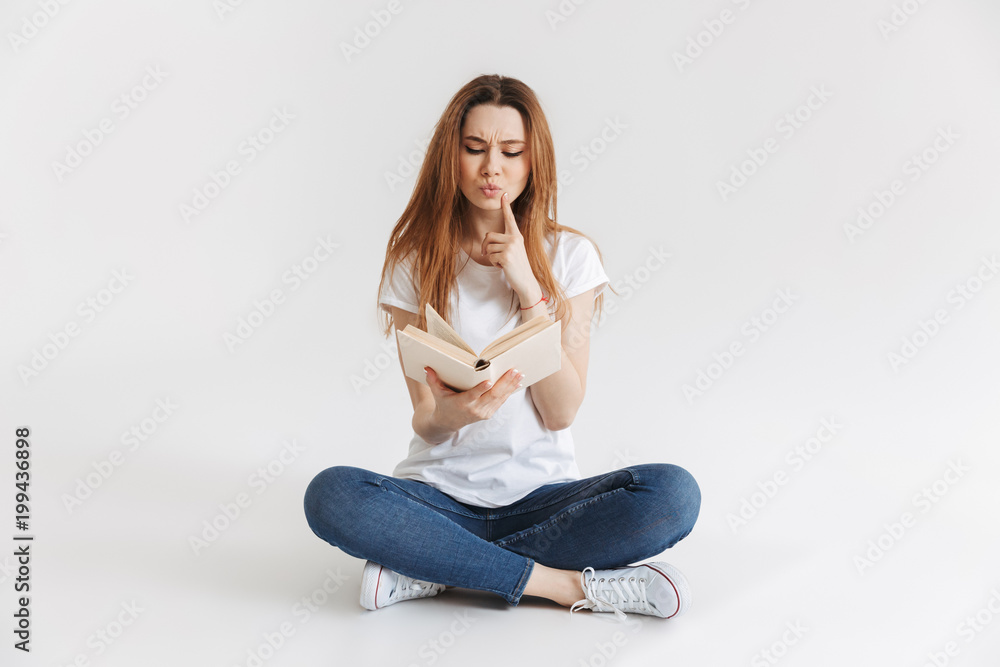 Portrait of a smart young girl holding book Portrait of a smart young girl holding book