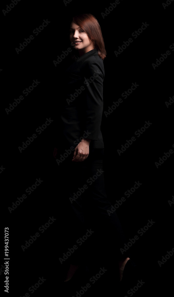 portrait of confident business woman. isolated on a dark background. portrait of confident business woman. isolated on a dark background.