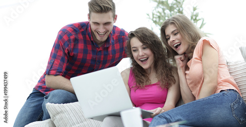 students people browsing through your favorite video on the laptop
