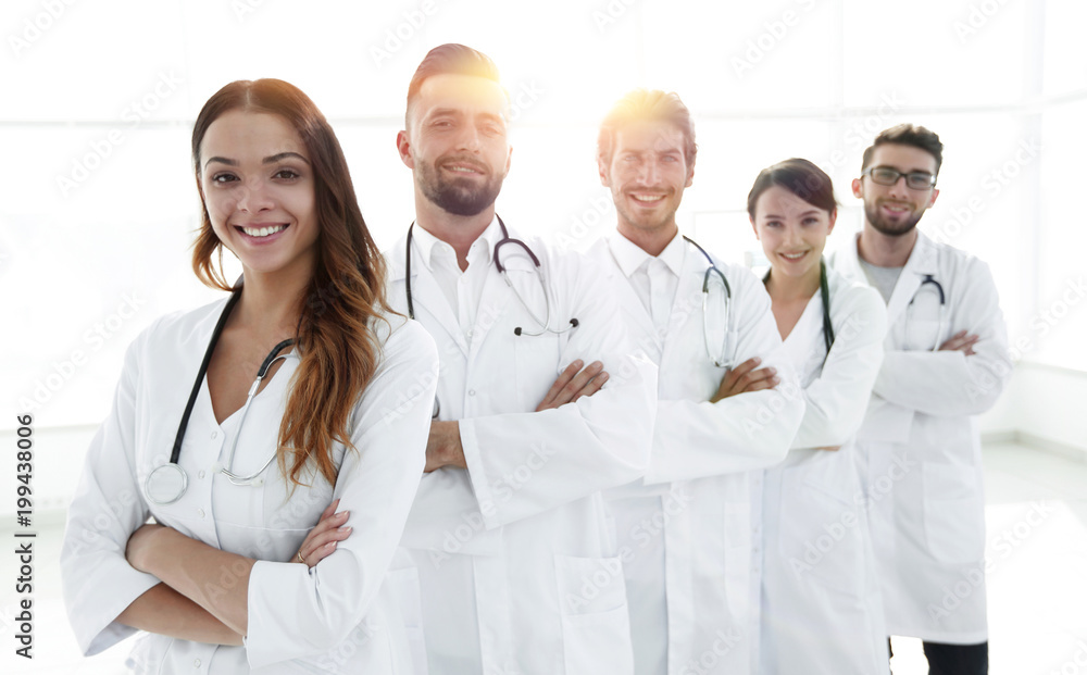 Portrait of medical team standing with arms crossed in hospital Portrait of medical team standing with arms crossed in hospital